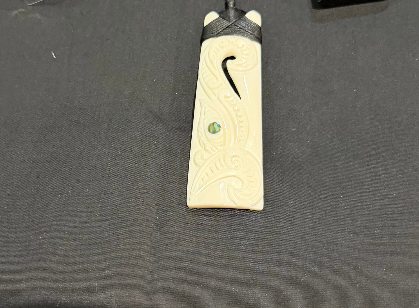 Carved Toki with Koru Beef Bone Pendant