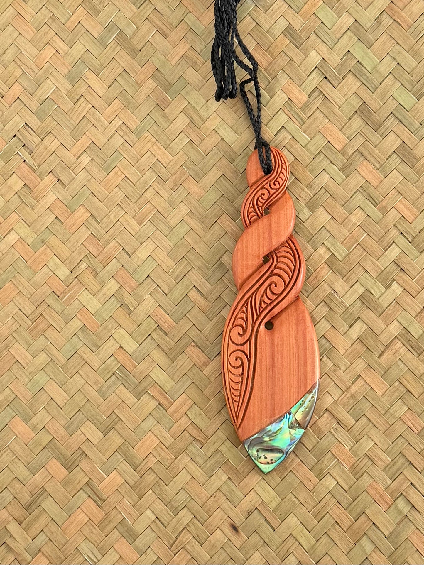 Wooden twist with Paua Pendant - Carving