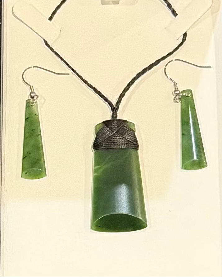 Green jade necklace and earrings set in a box