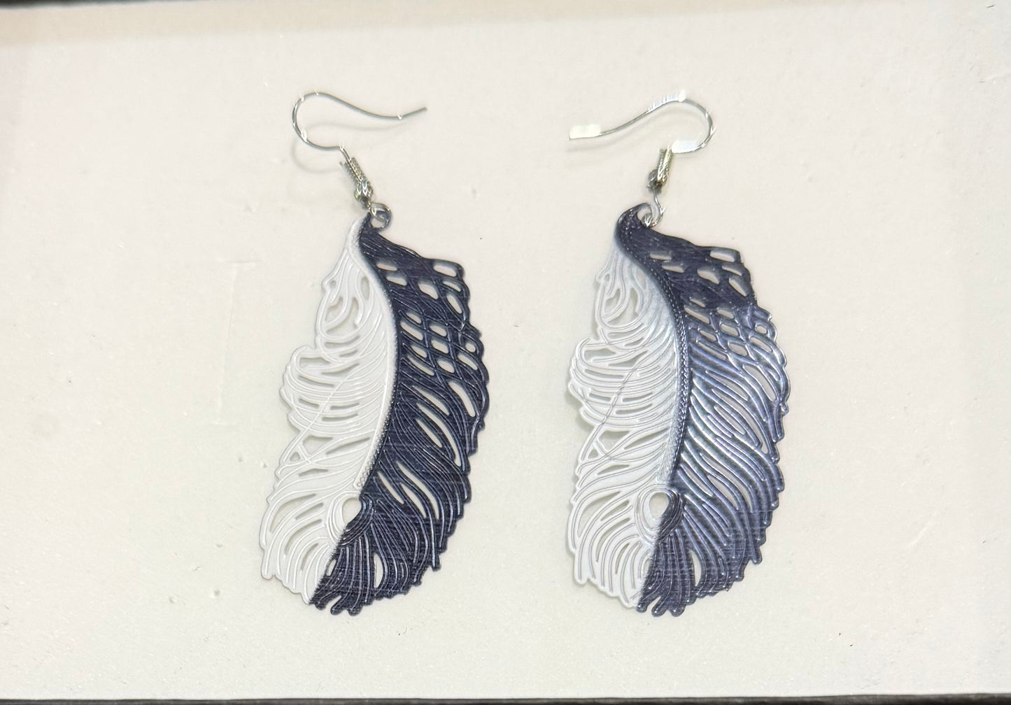 Metal black and white feather earrings