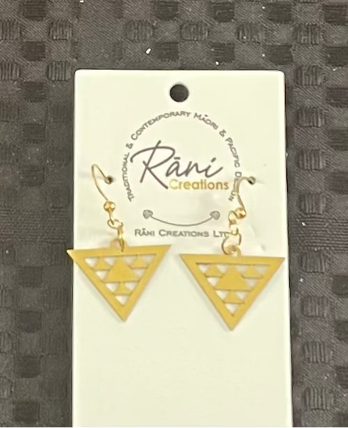 Gold triangle earrings on a Rani Creations branded card against a textured gray background