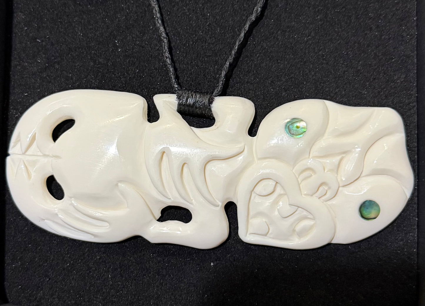 Sideway Bone Tiki Pendant