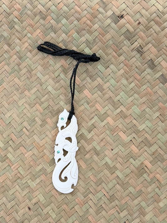 Carved double Manaia beef bone pendant