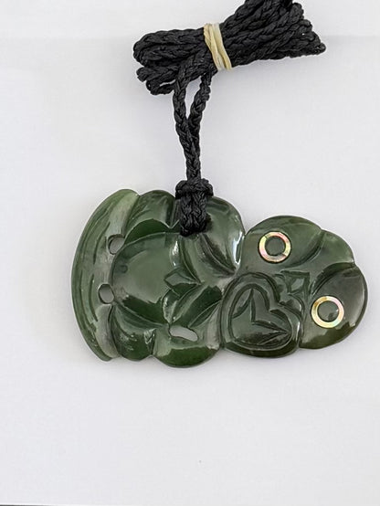 Sideway tiki greenstone pendant