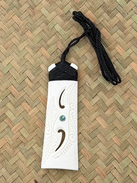 Carved toki beef bone pendant