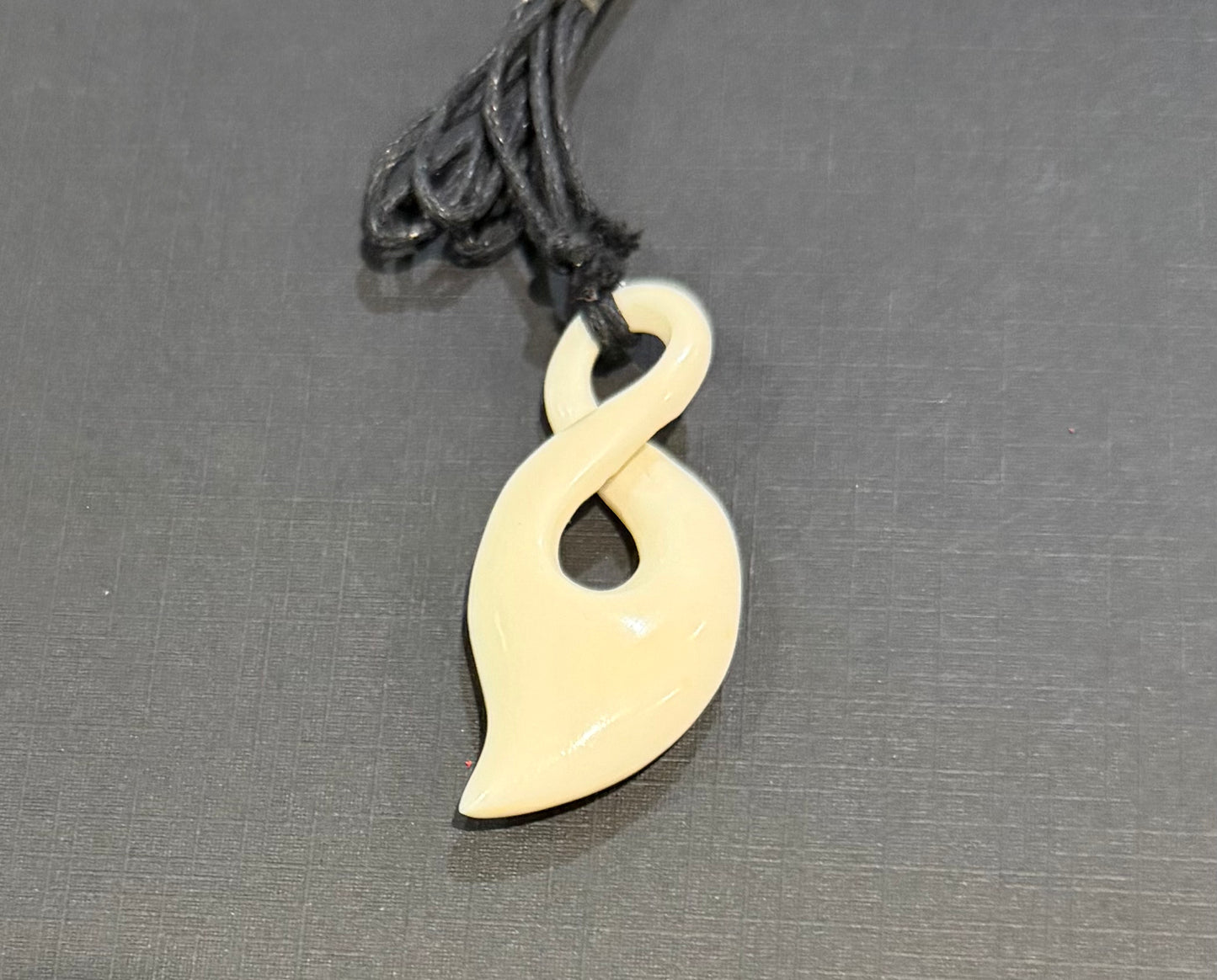 Beef bone twist pendant