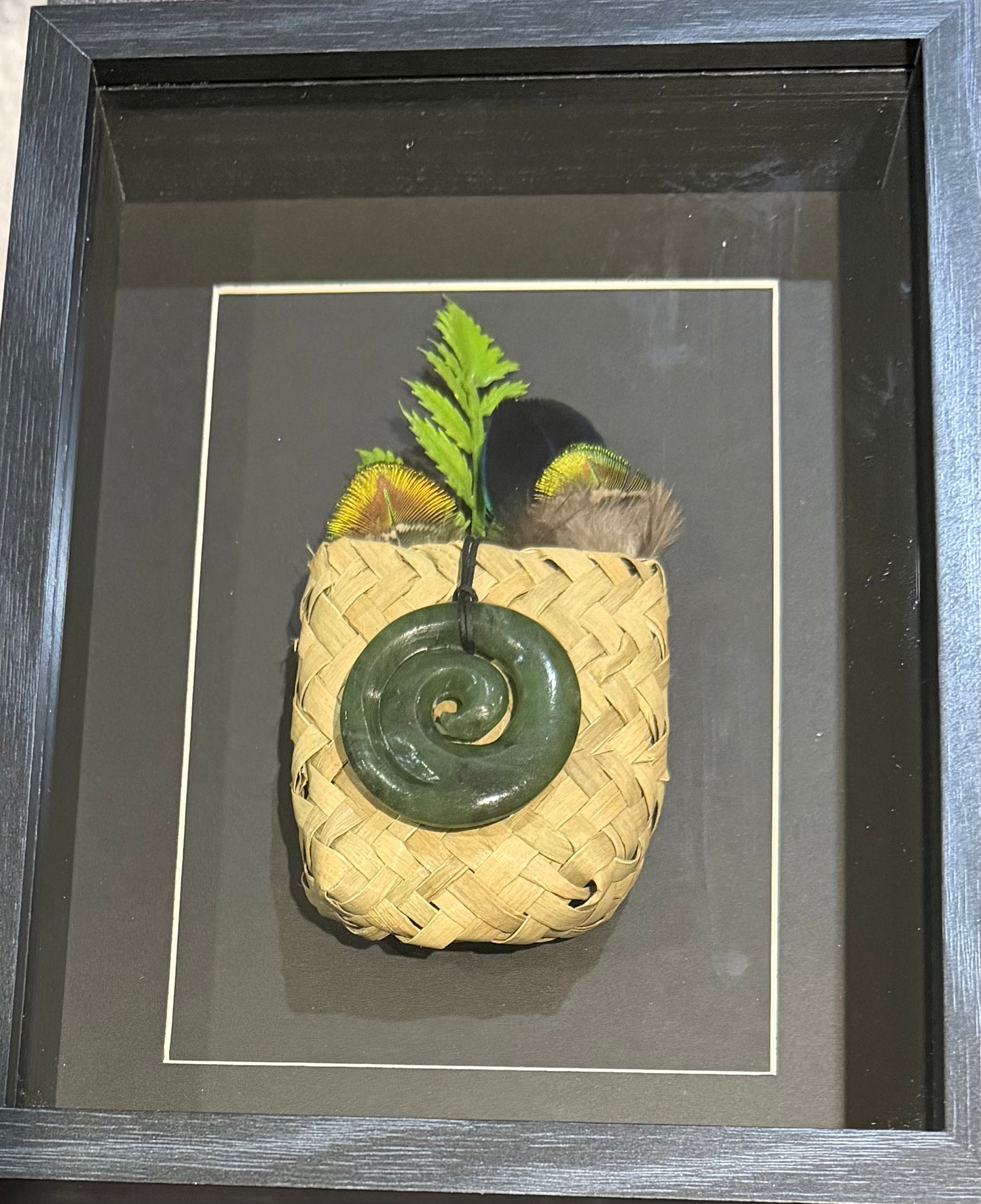 Greenstone Koru in a Kete with Feathers Framed