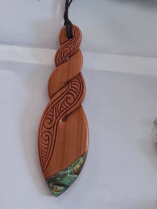Wooden twist with Paua Pendant - Carving