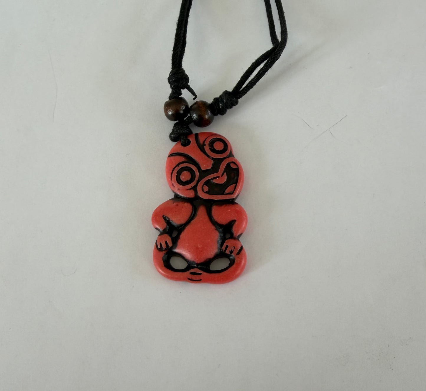 Resin tiki orange red pendant