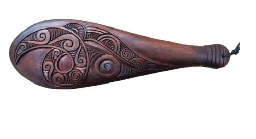 Beautifully hand-carved large Wooden Patu made from hardwood. With its Maori wooden carving design, this unique and stylish patu will bring an artisanal touch to your space. 