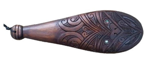This traditional wooden patu - wood carving is handcrafted with intricate detail that evokes its Maori origins. Its lightweight design and smooth wood make it perfect for carving on any surface. Show off your culture with this unique piece